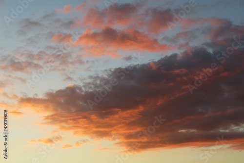 Dramatic orange black clouds in the sky at sunset, natural background