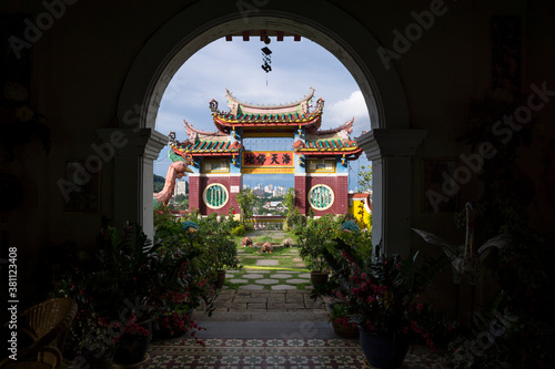 Arch at Kek Lok Si temple overlooking temple and skyline of Georgetown, Penang, Malaysia