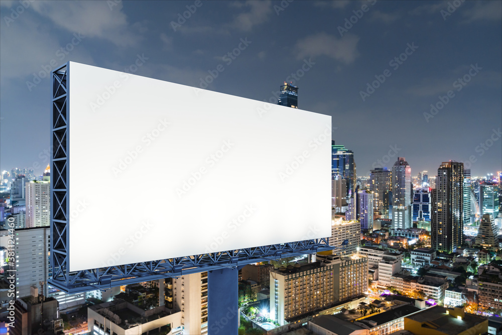 Blank white road billboard with Bangkok cityscape background at night time. Street advertising poster, mock up, 3D rendering. Side view. The concept of marketing communication to sell idea. Blank white road billboard with Bangkok cityscape background at night time. Street advertising poster, mock up, 3D rendering. Side view. The concept of marketing communication to sell idea.