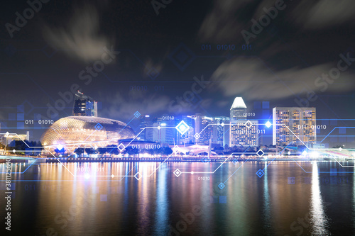 Information flow hologram, night panorama city view of Singapore. The largest technological center in Asia. The concept of programming science. Double exposure.