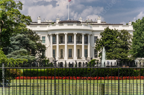 The White House in Washington DC with beautiful blue sky photo