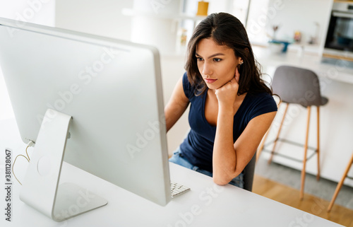 Beautiful young woman working on computer. Technology, people, work, study concept