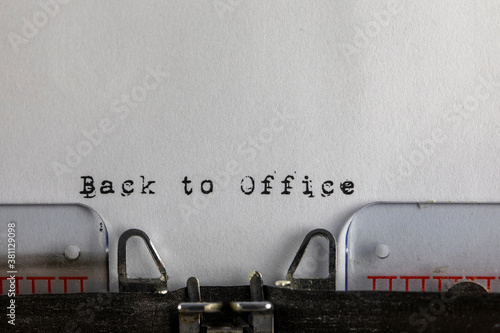 written on old typewriter with text Back to Office. Covid-19, Coronavirus concept