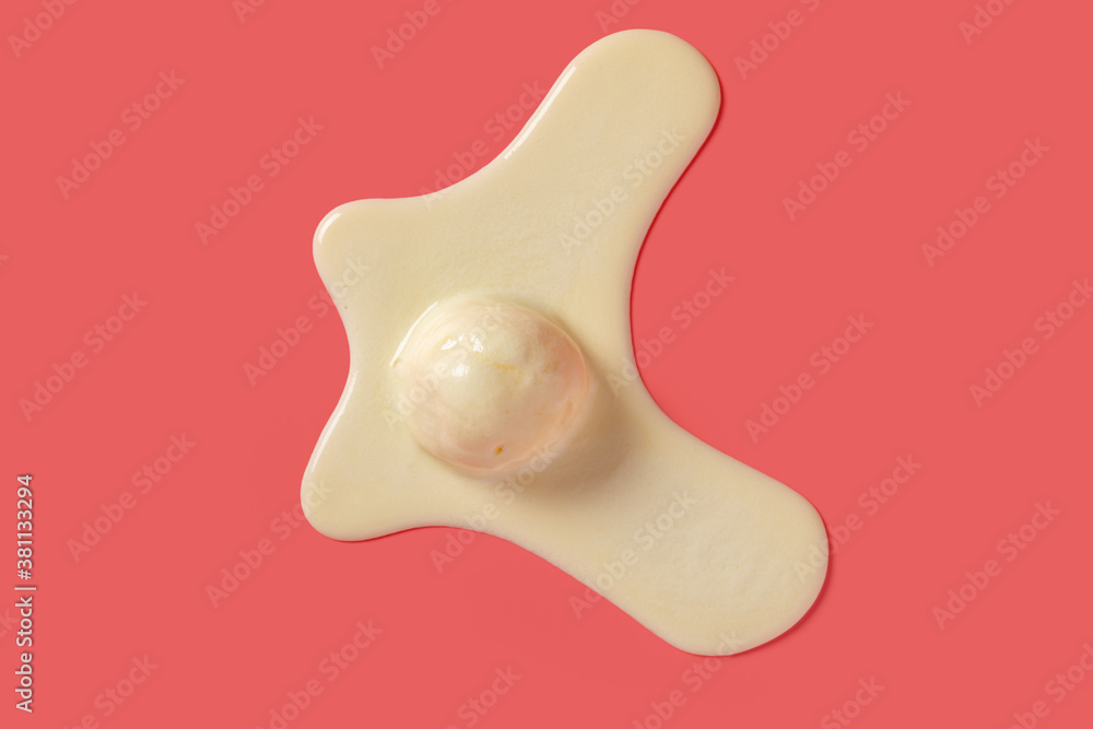 top view vanilla flavor ice cream ball in a melting process on pink background top view vanilla flavor ice cream ball in a melting process on pink background