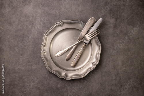 Photography vintage cutlery on a pewter plate