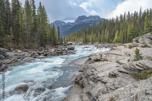 Mistaya River with Mount Sarbach and Epaulette Mountain in Banff National Park, Alberta, Canada photo