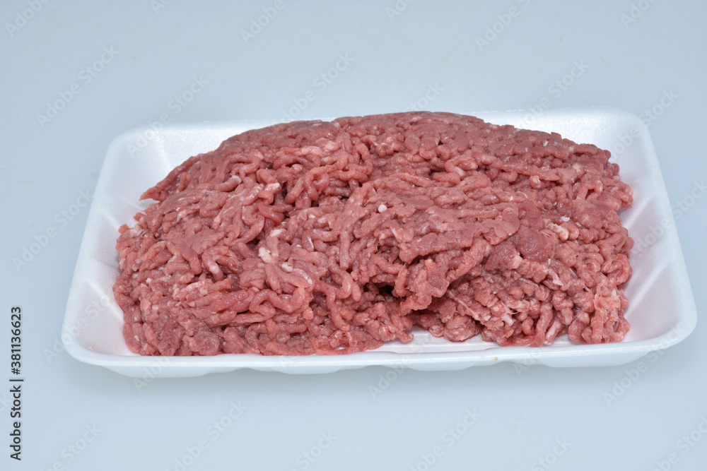 fresh organic mutton mince meat decorated in plate on white background fresh organic mutton mince meat decorated in plate on white background