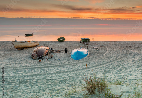 Coastal landscape with a small fishing boat that is still used for traditiona...