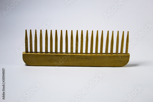 Wooden comb with white background