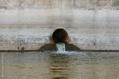 Rusty sewer pipe with water leaking into the reservoir