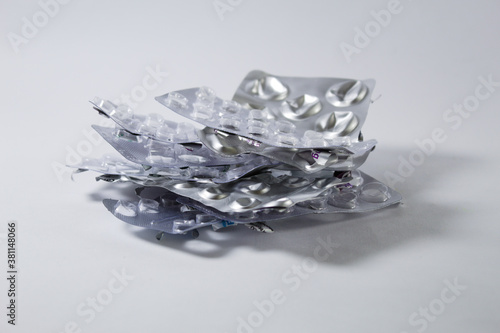 Crumpled medicine cards with white background