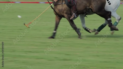 Two polo players in pursuit of a goal photo