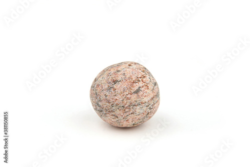 Sea smooth round pebble isolated on white background. Round  ball pebble stone from Baltic sea beach.