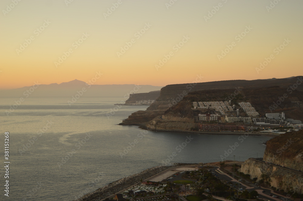 Sunset over Playa Amadores beach on Gran Canaria in Spain