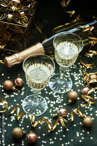 Happy New Year! Christmas and New Year holidays background, champagne in glasses