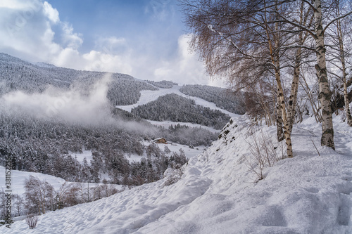 Landscape with Pyrenees Mountains in Andorra , Grandvalira ski area in El Tarter in winter day . photo