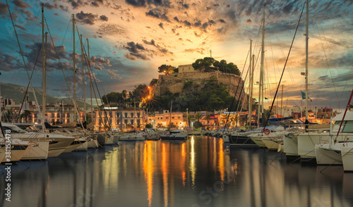 Views of Denia from the port on a September sunset photo