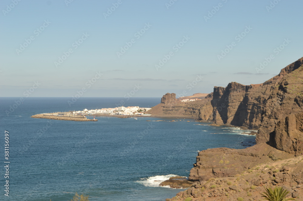 Sunset over the Amadores beach on the stunning island of Gran Canaria in Spain Sunset over the Amadores beach on the stunning island of Gran Canaria in Spain