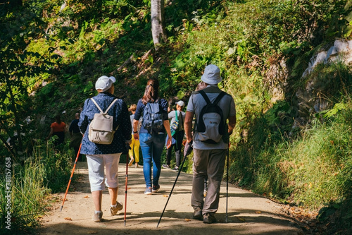 Sochi, Russia, 17 September 2020 -a couple of old people with trekking poles go trekking in the mountains