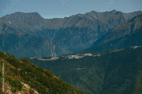 aerial view from the cable car to the Rosa Khutor resort in Sochi, Russia against of the Caucasus mountains