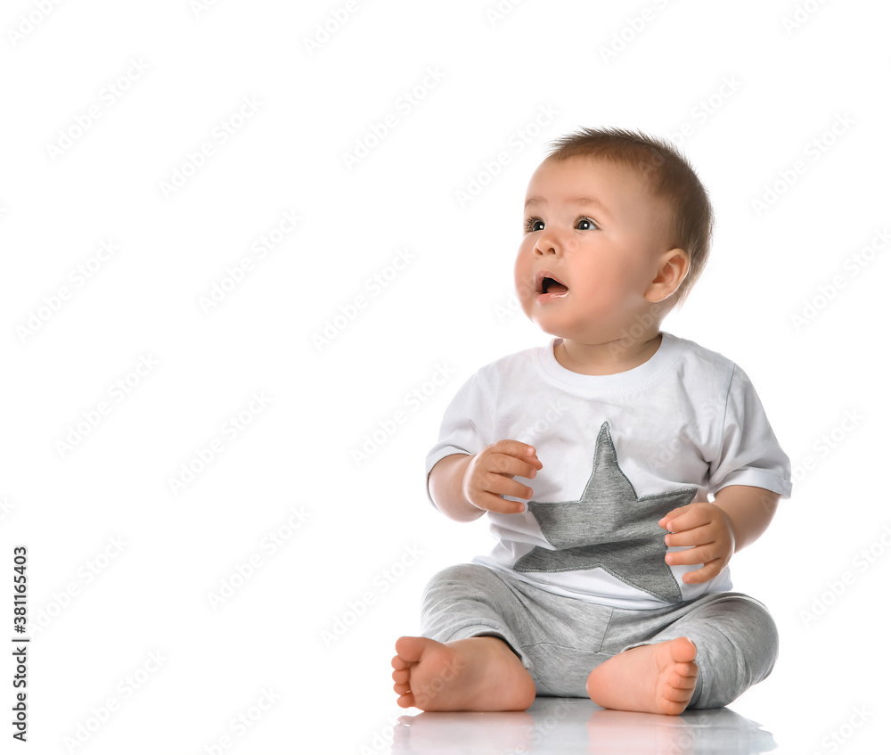 Happy baby boy sitting and laughing Happy baby boy sitting and laughing