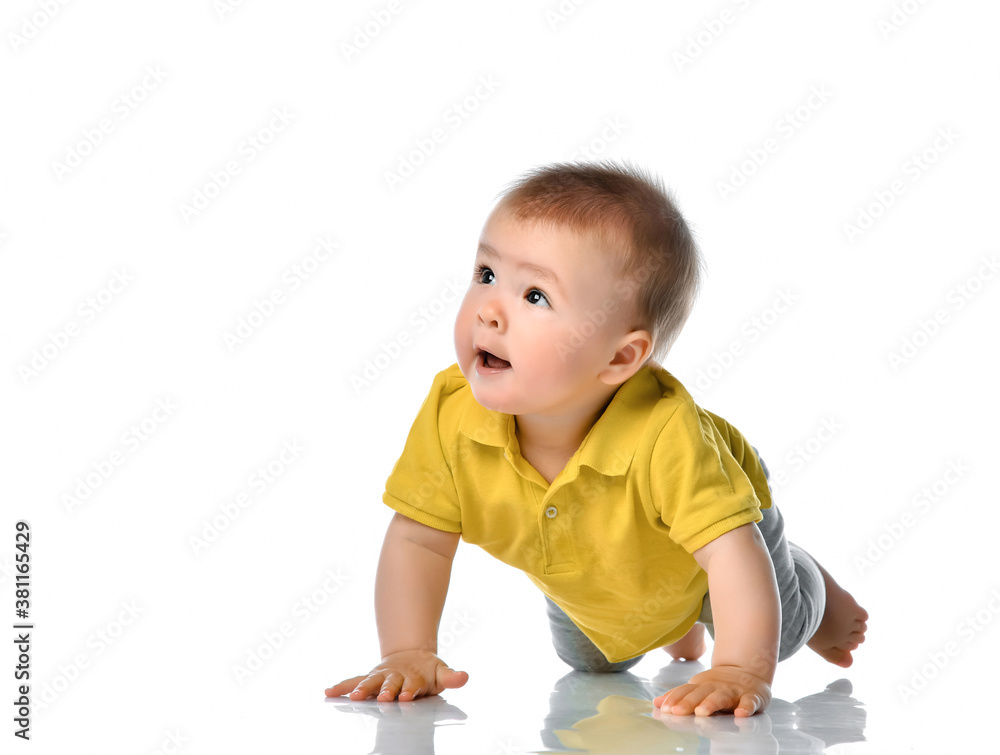 Curious baby crawling on white floor studio shot Curious baby crawling on white floor studio shot