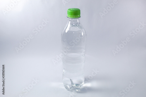 Mineral water bottle with green cap