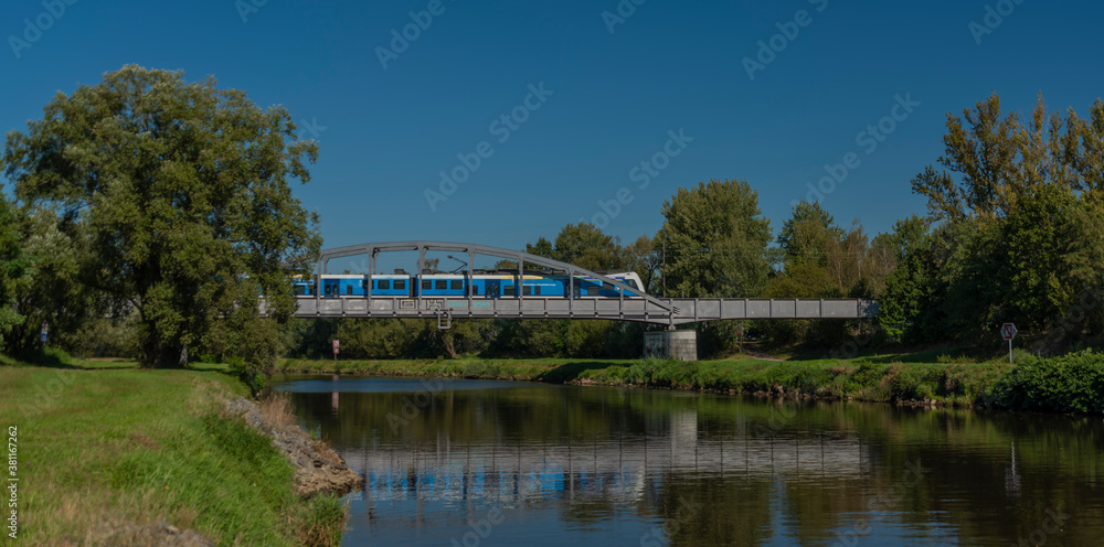 Railway bridge over Vltava river near Ceske Budejovice city in sunny day