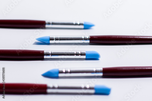 Brushes for artistic creation. The working ends are directed towards each other.