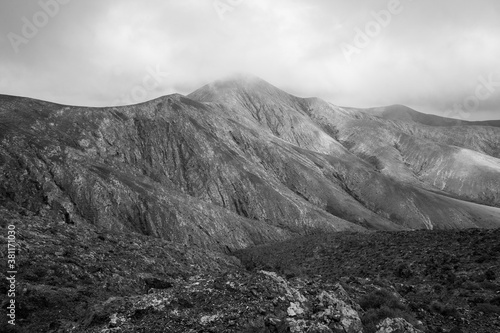 Mountain landscape view from Astronomical viewpoint Sicasumbre (Mirador Astronomico De Sica Sumbre). Fuerteventura. Canary Islands. Spain. Black and white.