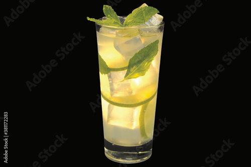 Fresh lemon homemade lemonade with ice cubes in a glass,