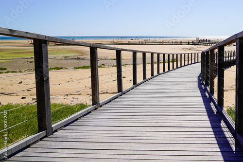 wooden pontoon sea access walkway on sandy beach atlantic ocean horizon in Jard sur Mer in france © OceanProd