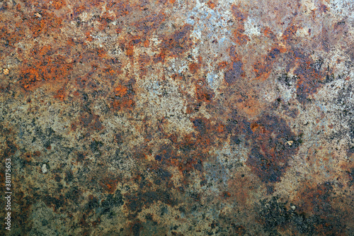 Rusting on the surface of old iron, steel destruction, decay and grunge textured background © IuriiA
