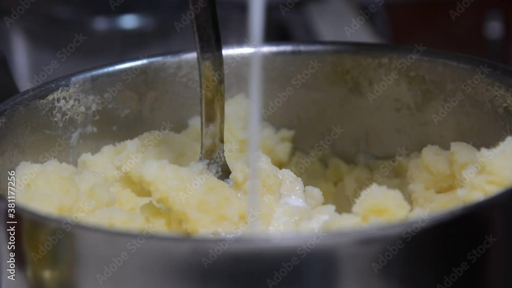 someone crushes mashed potatoes close up soft focus. someone crushes mashed potatoes close up soft focus.