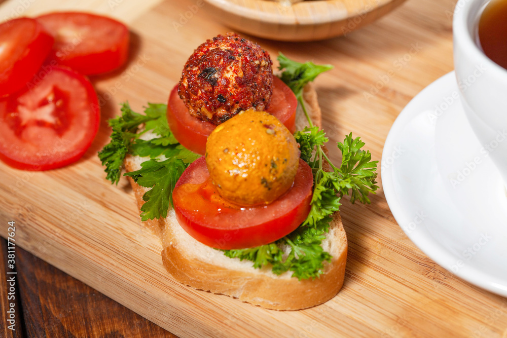 Aromatic Chevre cheese in olive oil on bruschetta