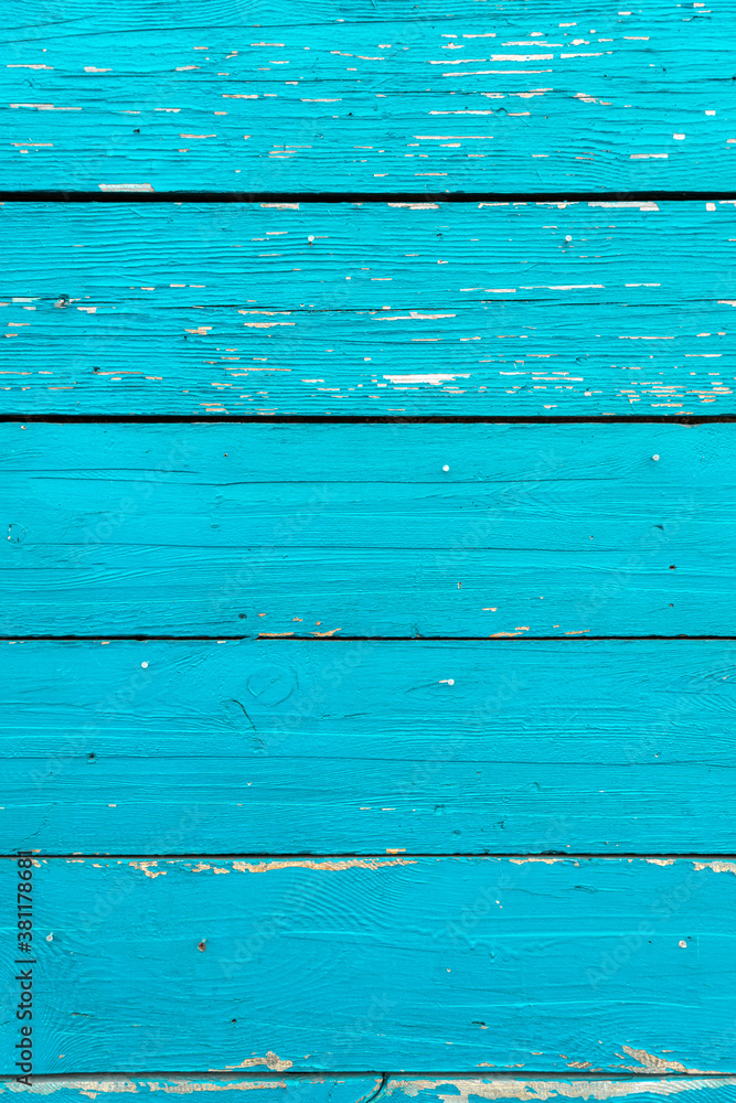 Planked background from boards painted with blue cracked paint Planked background from boards painted with blue cracked paint