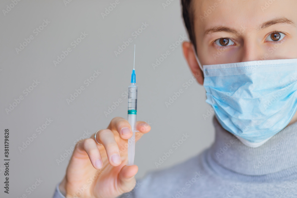 Male person in white glove hold vaccine bottle with syringe. Inj Male person in white glove hold vaccine bottle with syringe. Inj