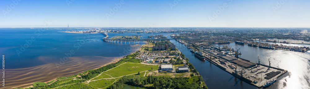 Aerial view of cargo ship, cargo container in warehouse harbor in the Morskie Vorota district in St. Petersburg