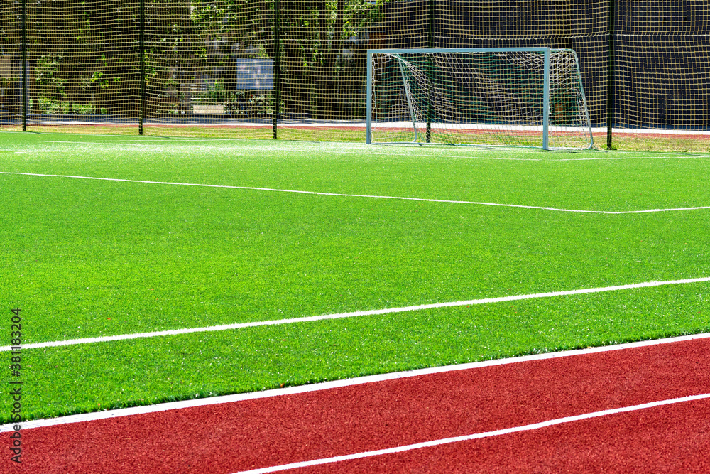 Fototapeta premium soccer gates. Football goal at the stadium. Football field with artificial lawn. Concept other party of soccer. At stadium.