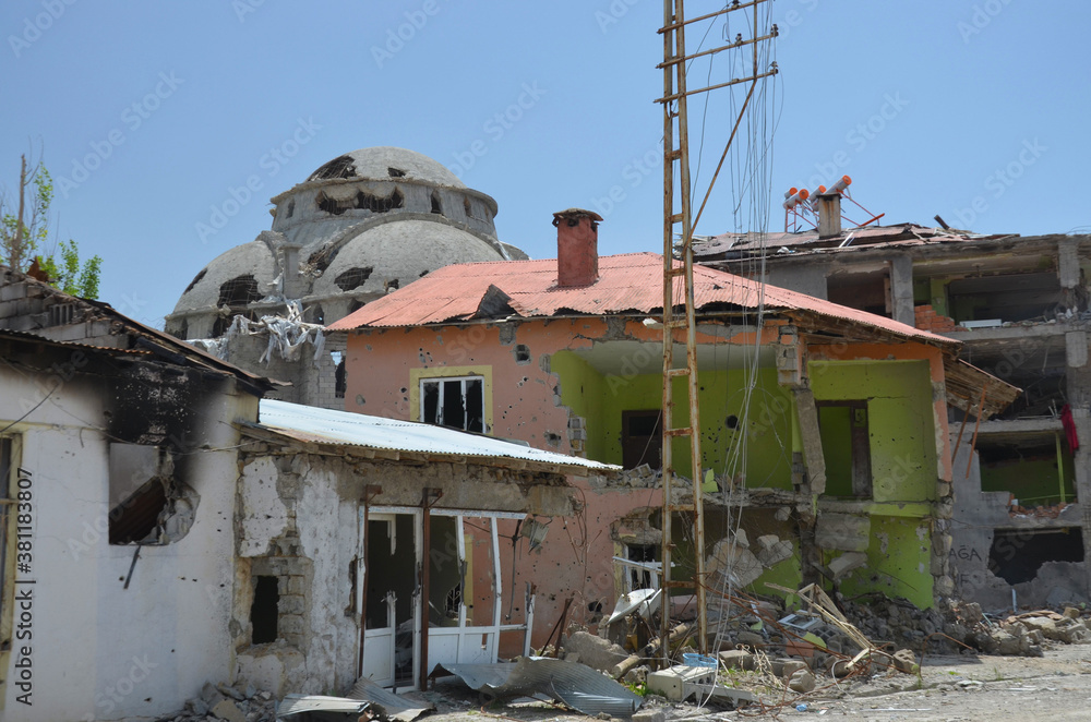 scars of war and conflict, a ruined building, a house