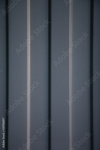 Industrial corrugated iron industrial texture wall made of tin sheets with bolts. Grunge metal plate background. Copyright space for site