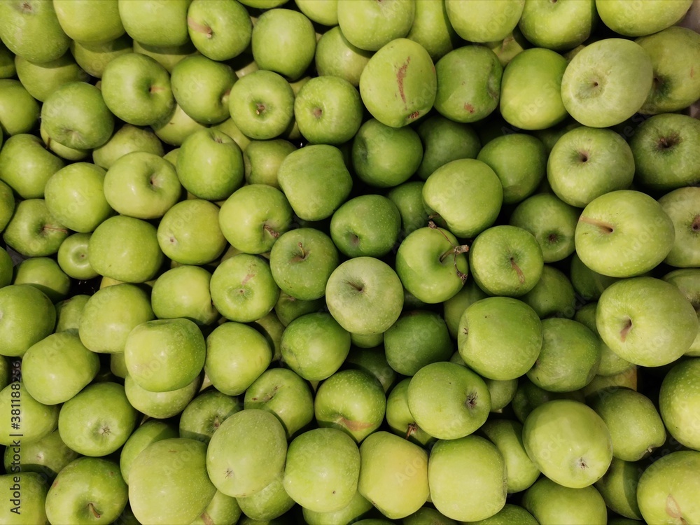 Green fresh apples in the grocery store that looks great Green fresh apples in the grocery store that looks great