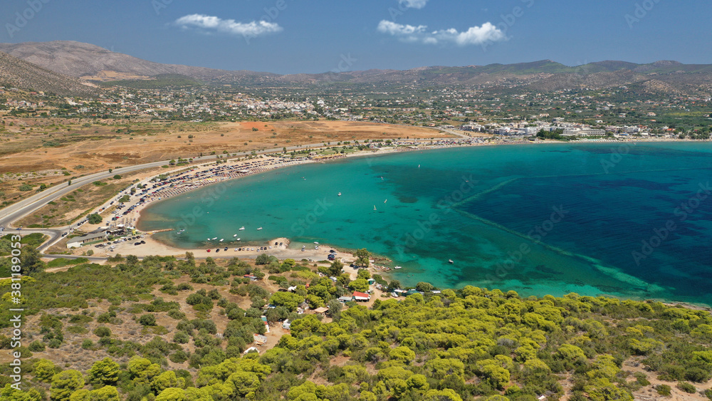 Aerial drone photo of famous organised beach and bay of Anavysos with crystal clear emerald sea popular to water sports, Athens riviera, Attica, Greece Aerial drone photo of famous organised beach and bay of Anavysos with crystal clear emerald sea popular to water sports, Athens riviera, Attica, Greece