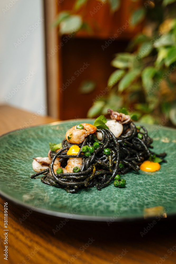 Black spaghetti with seafood and saffron sauce