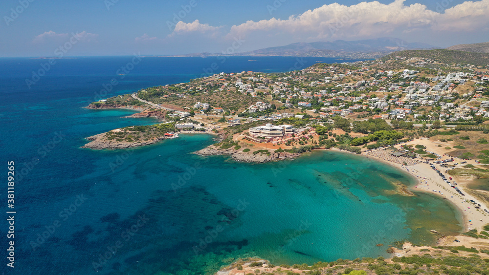 Aerial drone photo of famous islet, beach and bay of Agios Nikolaos in Anavysos area with crystal clear emerald sea, Athens riviera, Attica, Greece Aerial drone photo of famous islet, beach and bay of Agios Nikolaos in Anavysos area with crystal clear emerald sea, Athens riviera, Attica, Greece