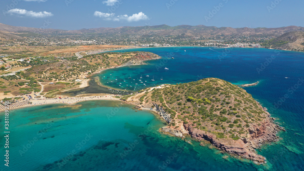 Aerial drone photo of famous islet, beach and bay of Agios Nikolaos in Anavysos area with crystal clear emerald sea, Athens riviera, Attica, Greece Aerial drone photo of famous islet, beach and bay of Agios Nikolaos in Anavysos area with crystal clear emerald sea, Athens riviera, Attica, Greece