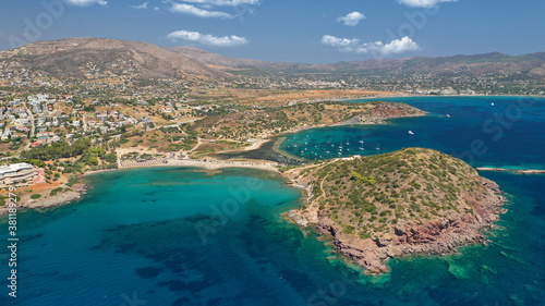 Fototapeta Naklejka Na Ścianę i Meble -  Aerial drone photo of famous islet, beach and bay of Agios Nikolaos in Anavysos area with crystal clear emerald sea, Athens riviera, Attica, Greece