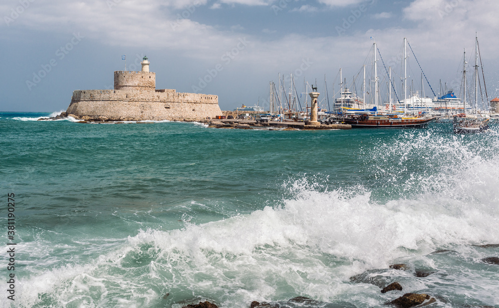 sea waves of azure color against the background of the lighthouse, Greece, Rhodes
sea waves of azure color against the background of the lighthouse, Greece, Rhodes