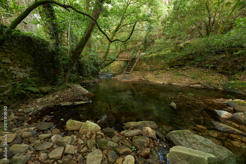 Wooden bridge over a small river in the Galicia area. Wooden bridge over a small river in the Galicia area.