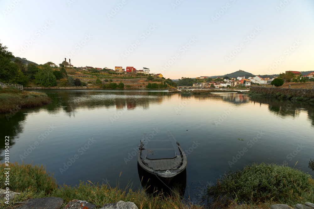 Fototapeta premium Small abandoned boat at the mouth of the Verdugo river in Galicia.